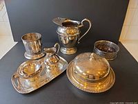 Group shot of all silver-plated serving pieces