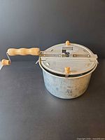 Full view of popcorn maker with crank handle attached