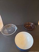 Overall view of Pyrex pie plate, Vision bowl, Copco enamel bowl