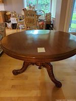 Full view of round tabletop and pedestal base