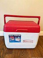 Front view showing Cold Storage decal, Rubbermaid logo, handle raised