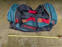 Full view of closed Salomon duffel showing size and exterior condition