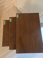 Top view of three nested table tops showing finish