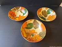Top view of three floral fibreglass bowls