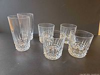 Group view of all six clear faceted glasses, showing relative heights