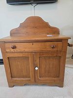 Front view showing drawer, cabinet doors, backsplash