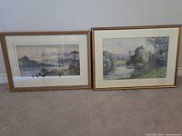 Both framed prints side by side on floor