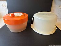 Salad spinner and cake carrier side by side