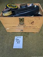 Overall view of open Ronson box with polisher, polish tins visible