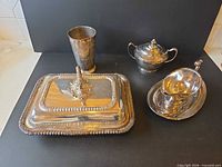 group shot of all four silver-plated pieces