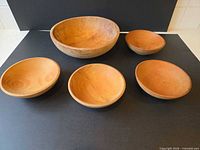 all five wooden bowls arranged, showing sizes