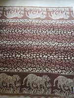 Full view showing animal print field and tiger borders