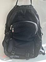 Front view showing overall design, compartments, straps and buckles