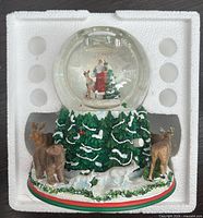 Full view of snow globe in foam packaging