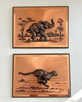 Both plaques displayed together showing elephant and cheetah designs