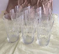 all nine clear patterned glass tumblers standing upright