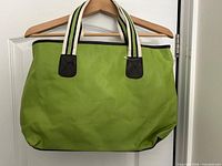 front view of green tote showing handles, trim and shape