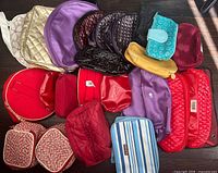 All pouches laid out displaying variety of sizes, shapes and colors