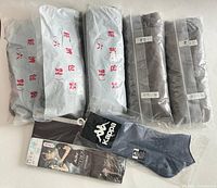 All items overview: sealed pantyhose packs, folded pantyhose, Kappa socks and Sexy Lady pack