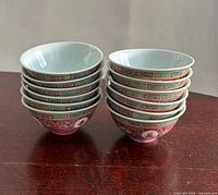 Two stacks of small patterned bowls