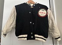 Full front view of jacket showing colours, style and staining