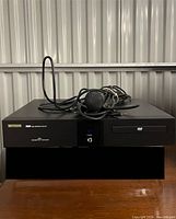 Front view of BestSound karaoke player with microphone and cables on top