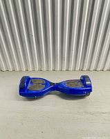 Top view of blue hoverboard showing overall condition and footpads