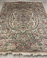 Full view of rug showing pattern and fringe