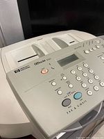 Control panel with HP OfficeJet K60 branding and buttons