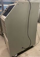 Right side view of the Koldwave portable AC showing cabinet and casters