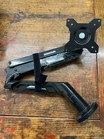 Full arm folded showing VESA plate and base