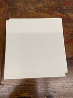 Top view of square cardstock sheets