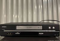 Front view showing full VCR, brand name, cassette door and controls