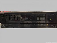 Front panel showing model, controls, display