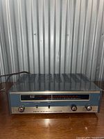 Front view showing model, controls and dial