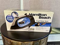 Retail box of Hamilton Beach iron model 14506