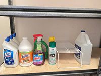 Full lot on shelving showing all bottles and wire shelf