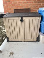 Front view of Keter storage cabinet on balcony