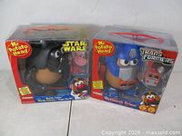 Front view of both sealed Mr. Potato Head boxes