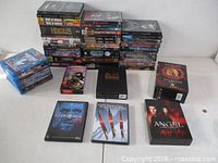 Overall view of stacks and box sets on table