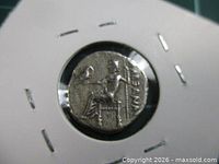 Reverse of coin showing seated Zeus and Greek legend