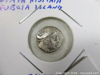 Obverse bust of Histiaia on ancient Greek drachm coin in holder