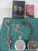 Bronze and silver tone pocket watches, pin, presentation box