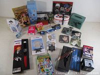Overall lot overview showing all packaged anime items on table
