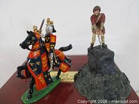 Both Britains figures side by side on display base