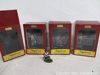 Group shot of three boxed figures and one loose Highlander