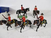 Five mounted Britains figures grouped together