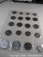 Full 20-slot sleeve showing all coins