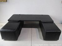 Full view of Couchmaster with tabletop bridging two armrest cushions