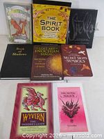 All eight books laid out showing covers